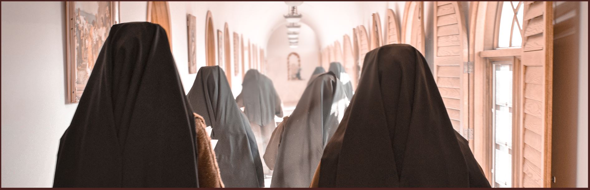 The Poor Clares of Perpetual Adoration processing through the cloister hallways.